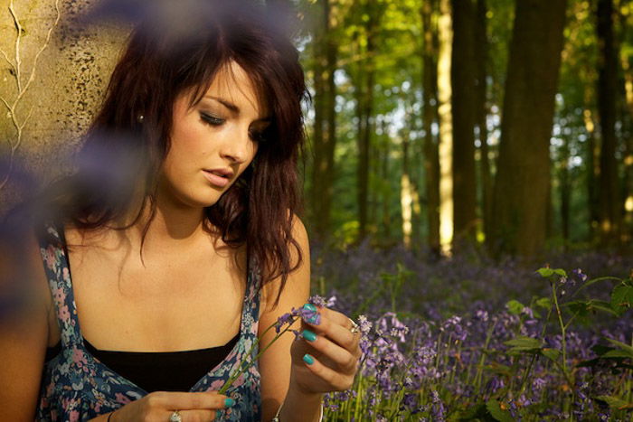 A female model posing in a forest