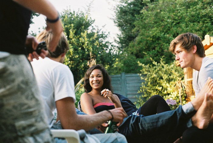 A group of friends hanging out at a garden party