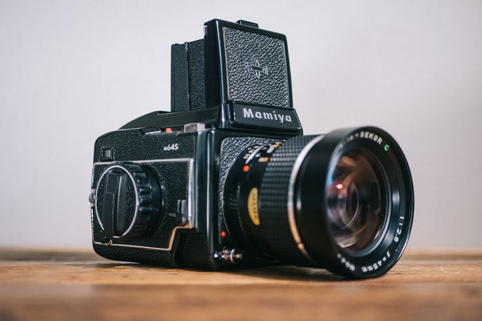 Medium format mamiya camera on a table