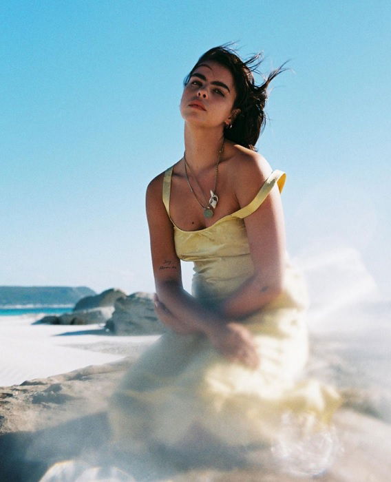 portrait of a girl in yellow dress on the beach