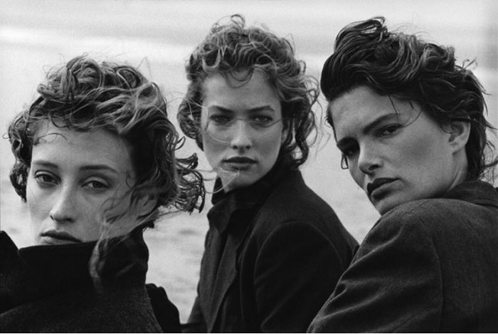 portrait of three models on a beach 