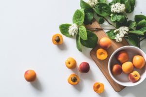 Tabletop photography of fruit and flowers