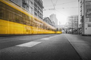 A blurred yellow tram in a black-and-white photo showing motion blur photography